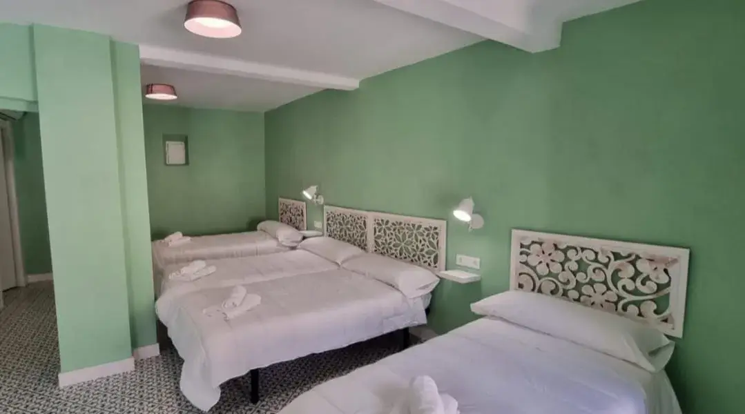 habitacion2-camas-apartamentos-andrada